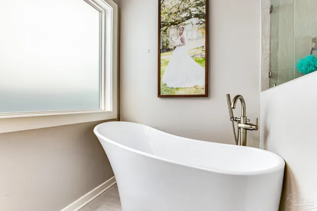 a white bath tub sitting in a bathroom
