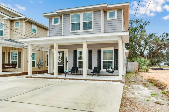front view of a brick house with a outdoor space