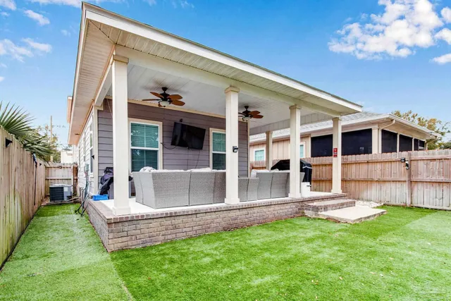 a view of house with yard and entertaining space