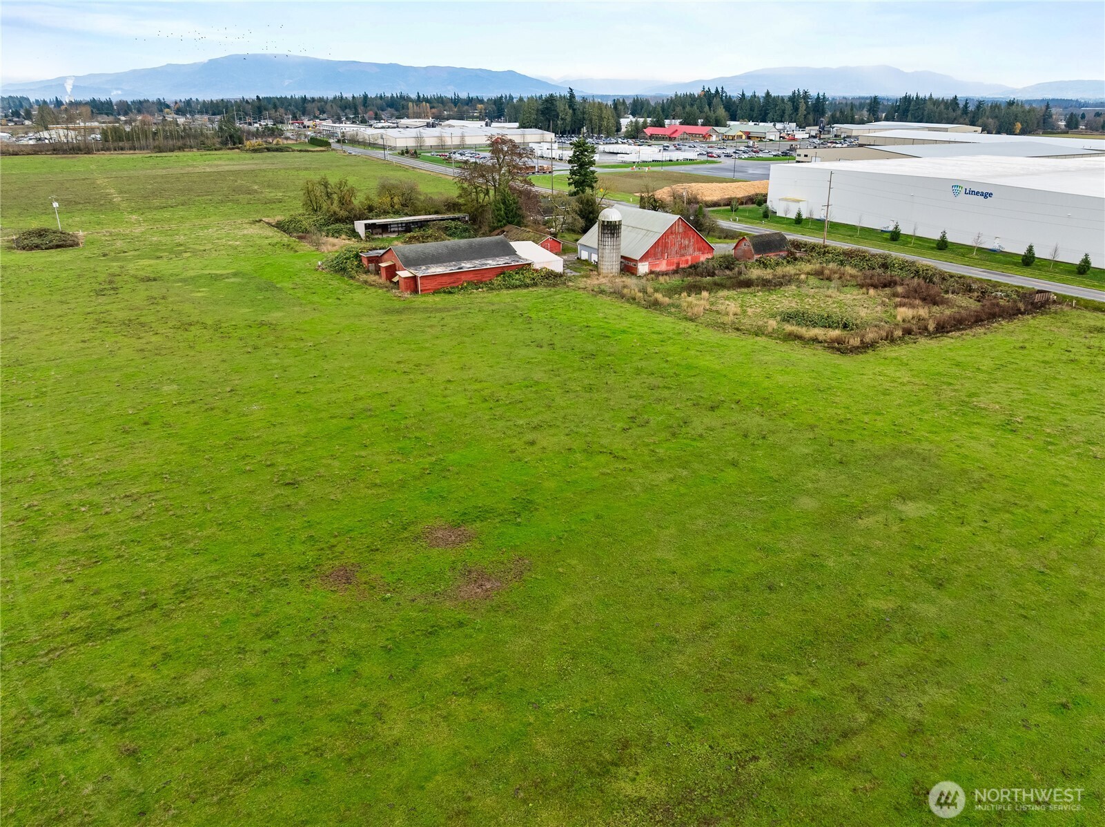 2208 West Main Street Lynden, WA 98264 - Photo 2 of 3 a view of a lake with houses in the background