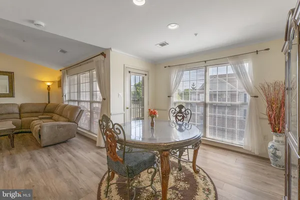 a kitchen with stainless steel appliances a refrigerator stove microwave and sink