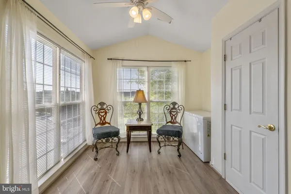 a kitchen with granite countertop a refrigerator a sink a stove a microwave and island