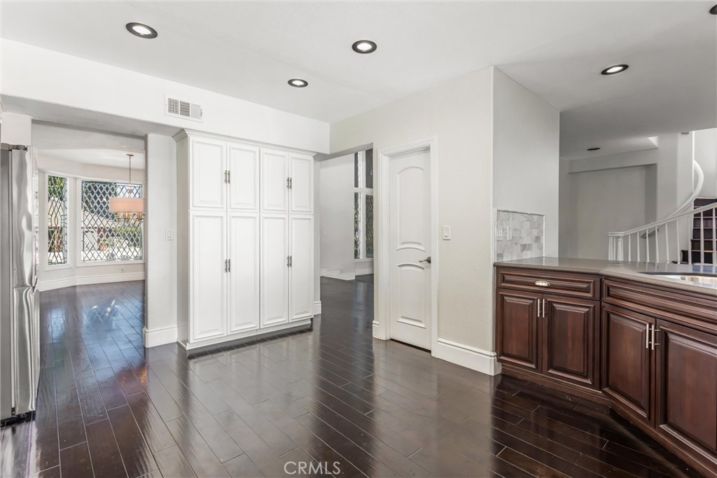 1608 Smiley Ridge Redlands, CA 92373 - Photo 26 of 84 a view of a kitchen with wooden floor and a sink