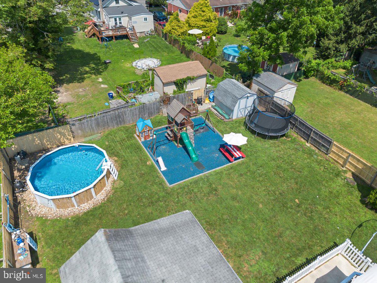 1727 6th Street Ewing, NJ 08638 - Photo 11 of 40 an aerial view of a house with swimming pool and tennis court