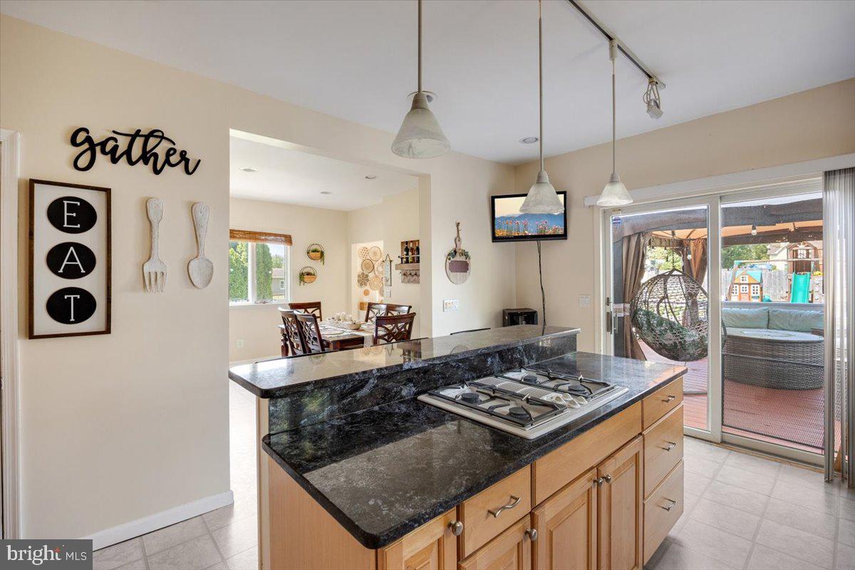 1727 6th Street Ewing, NJ 08638 - Photo 26 of 40 a kitchen with a stove and a refrigerator