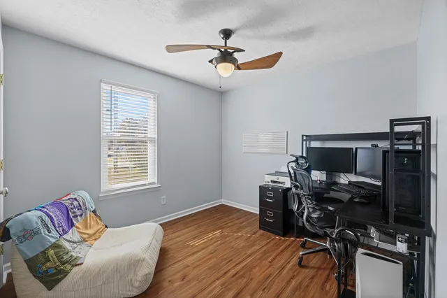 a bedroom with bed and window