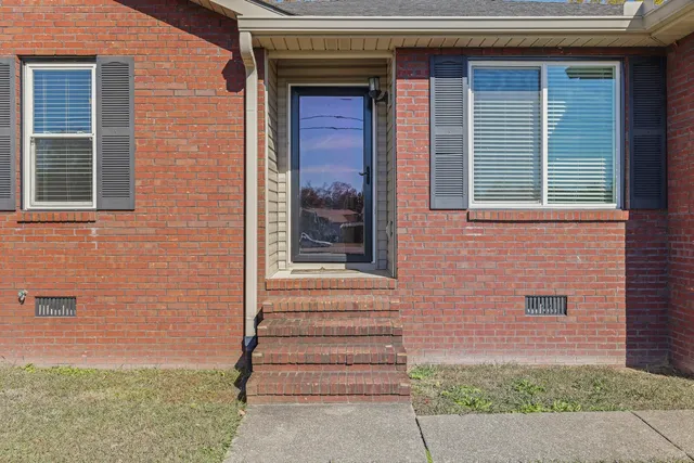 a front view of a house with a garage