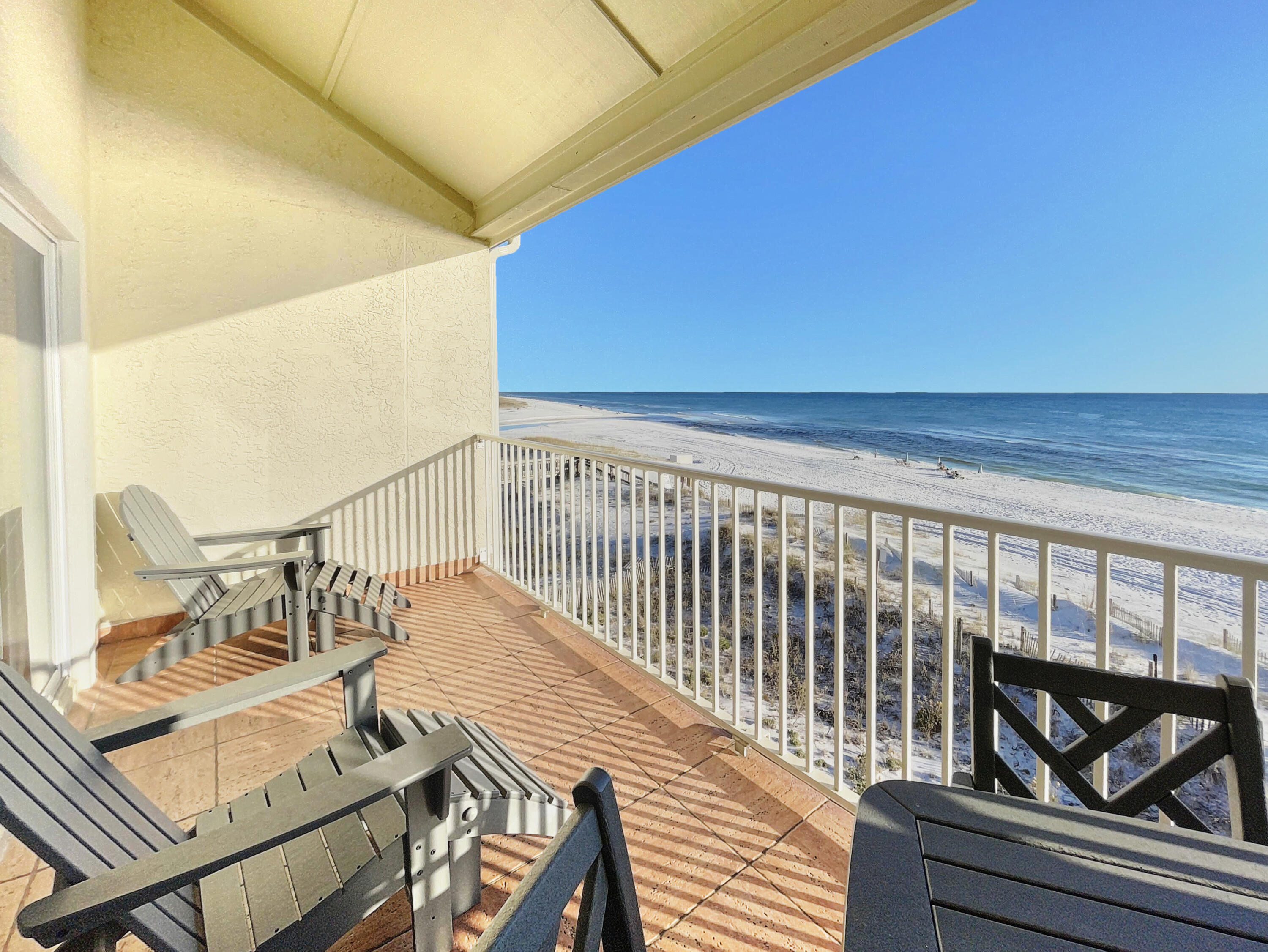 595 Eastern Lake Road, Unit 213 Santa Rosa Beach, FL 32459 - Photo 1 of 18 a view of balcony with two chairs and wooden floor
