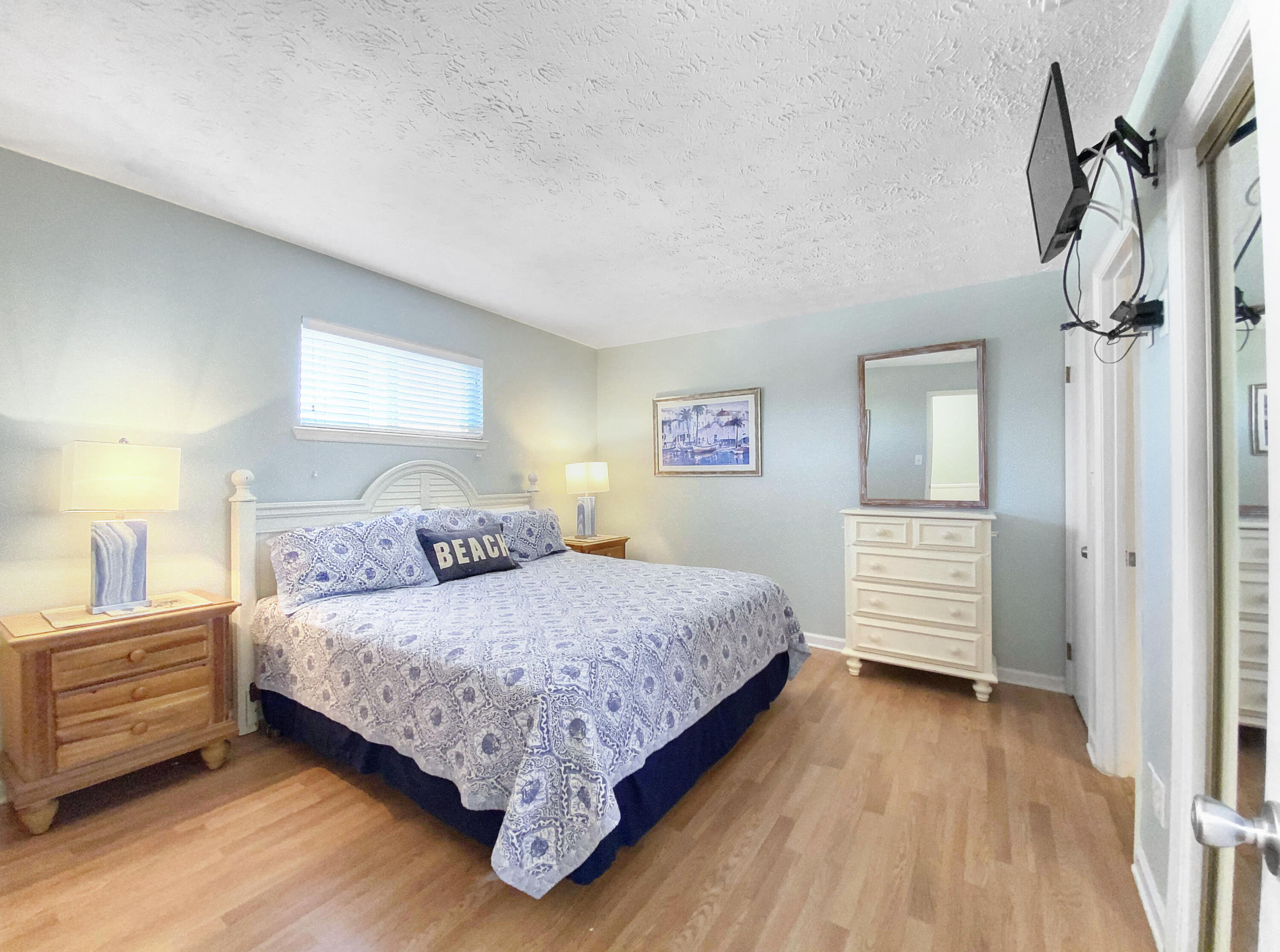 595 Eastern Lake Road, Unit 213 Santa Rosa Beach, FL 32459 - Photo 11 of 18 a bedroom with a bed and a painting on the wall