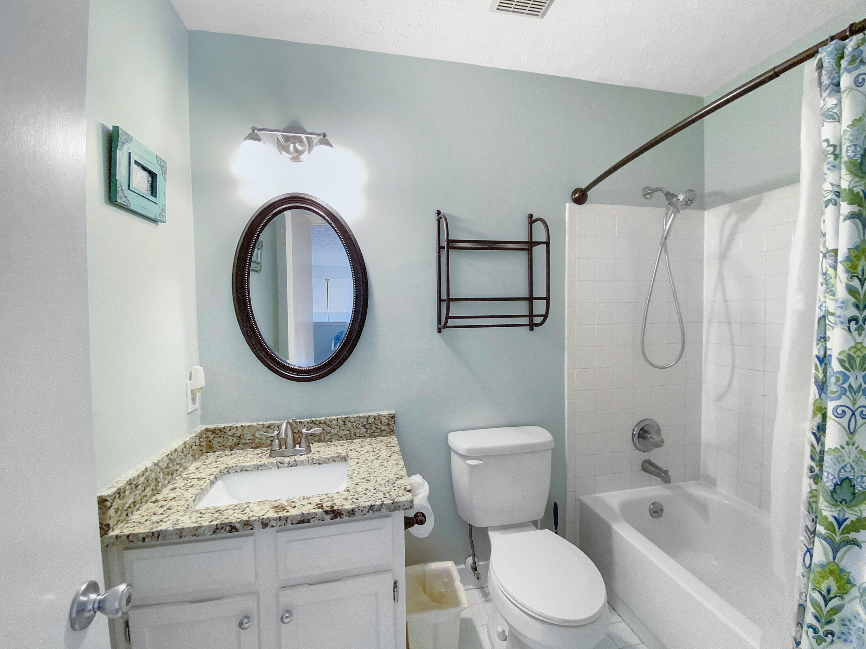 595 Eastern Lake Road, Unit 213 Santa Rosa Beach, FL 32459 - Photo 17 of 18 a bathroom with a granite countertop sink toilet and shower