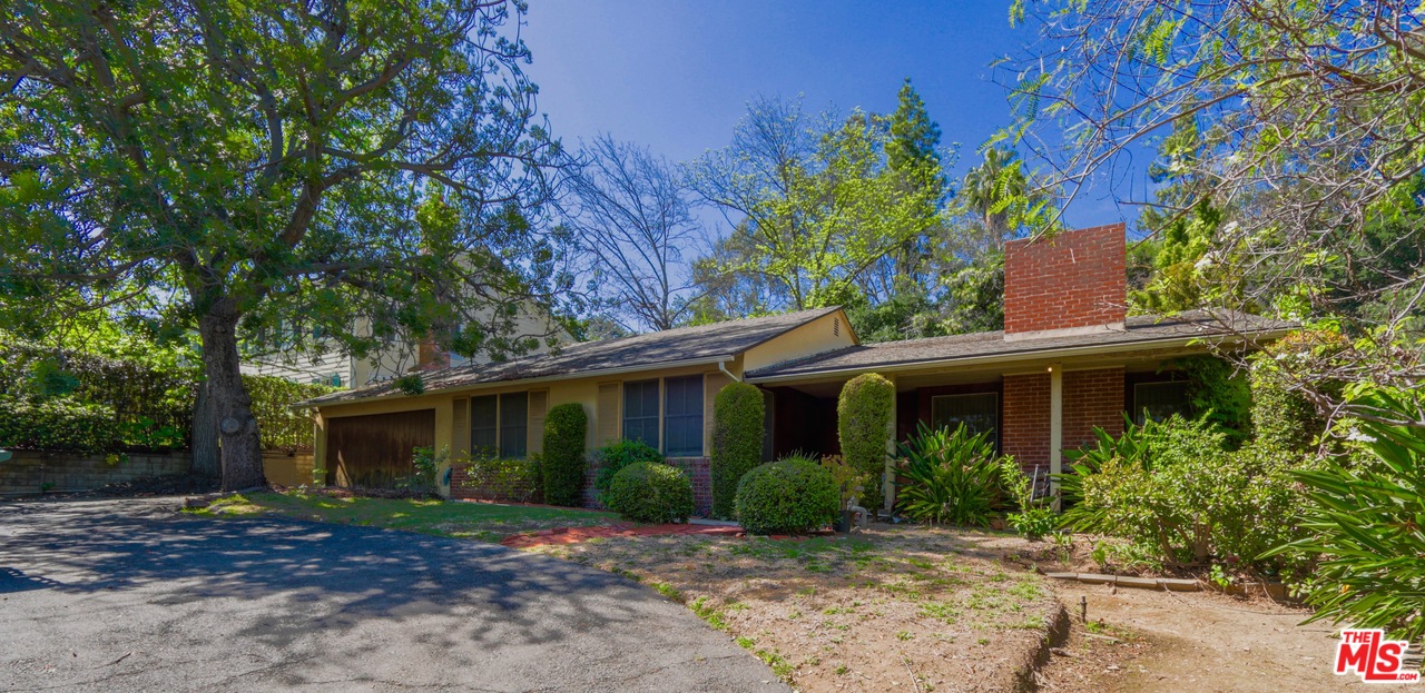 1065 Old Mill Road Pasadena, CA 91108 - Photo 2 of 7 a front view of a house with a garden