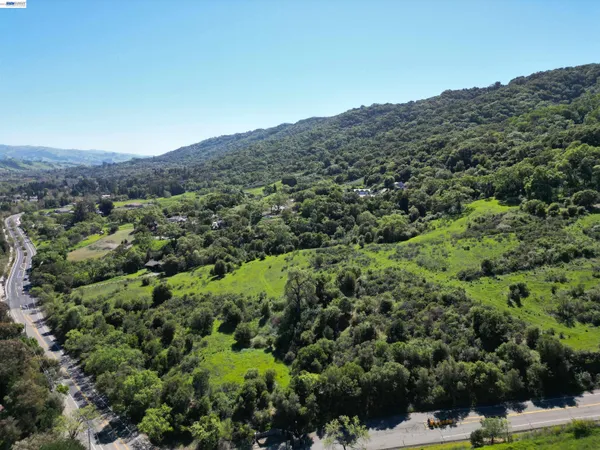 a view of backyard with a small swimming pool
