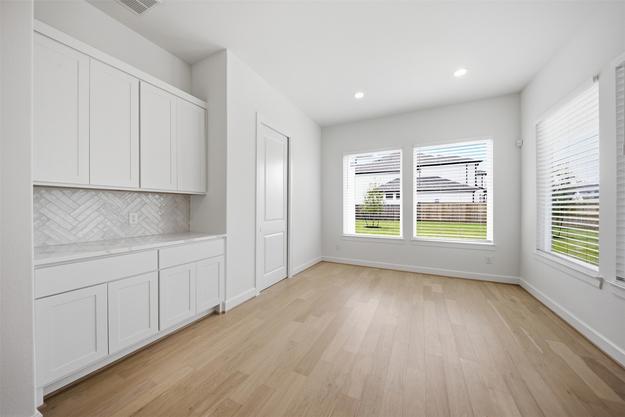 416 Venado View Court Conroe, TX 77304 - Photo 10 of 34 Bright and airy dining space conveniently located adjacent to the kitchen with abundant natural light and built-in serving cabinetry.
