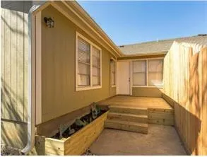 a bedroom with bed and window