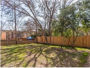 6403 Auburn Drive, Unit B Austin, TX 78723 - Photo 17 of 18 a view of a yard with a large tree