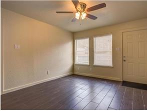 6403 Auburn Drive, Unit B Austin, TX 78723 - Photo 6 of 18 an empty room with wooden floor and windows