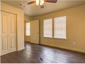 6403 Auburn Drive, Unit B Austin, TX 78723 - Photo 9 of 18 a view of an empty room with a window and wooden floor