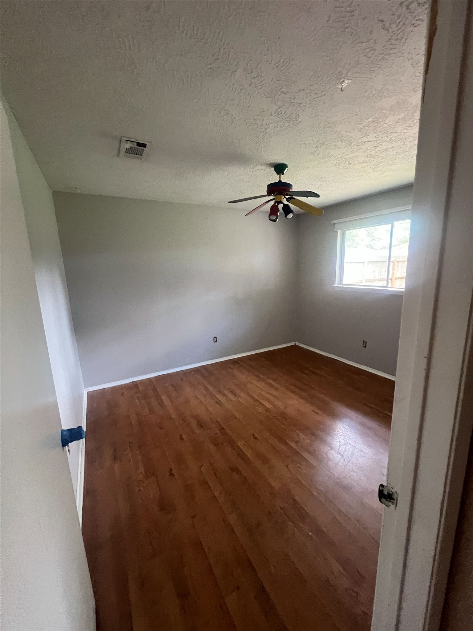 6507 Bridgegate Drive Spring, TX 77373 - Photo 10 of 17 an empty room with a empty space and windows