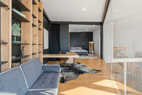 a lobby with furniture and floor to ceiling window