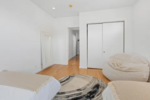 a bedroom with a bed and couch