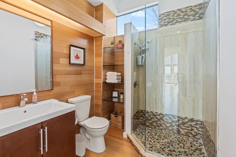 a bathroom with a sink toilet and shower