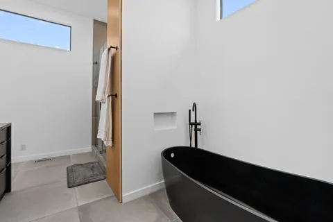 a room with a chair and a window