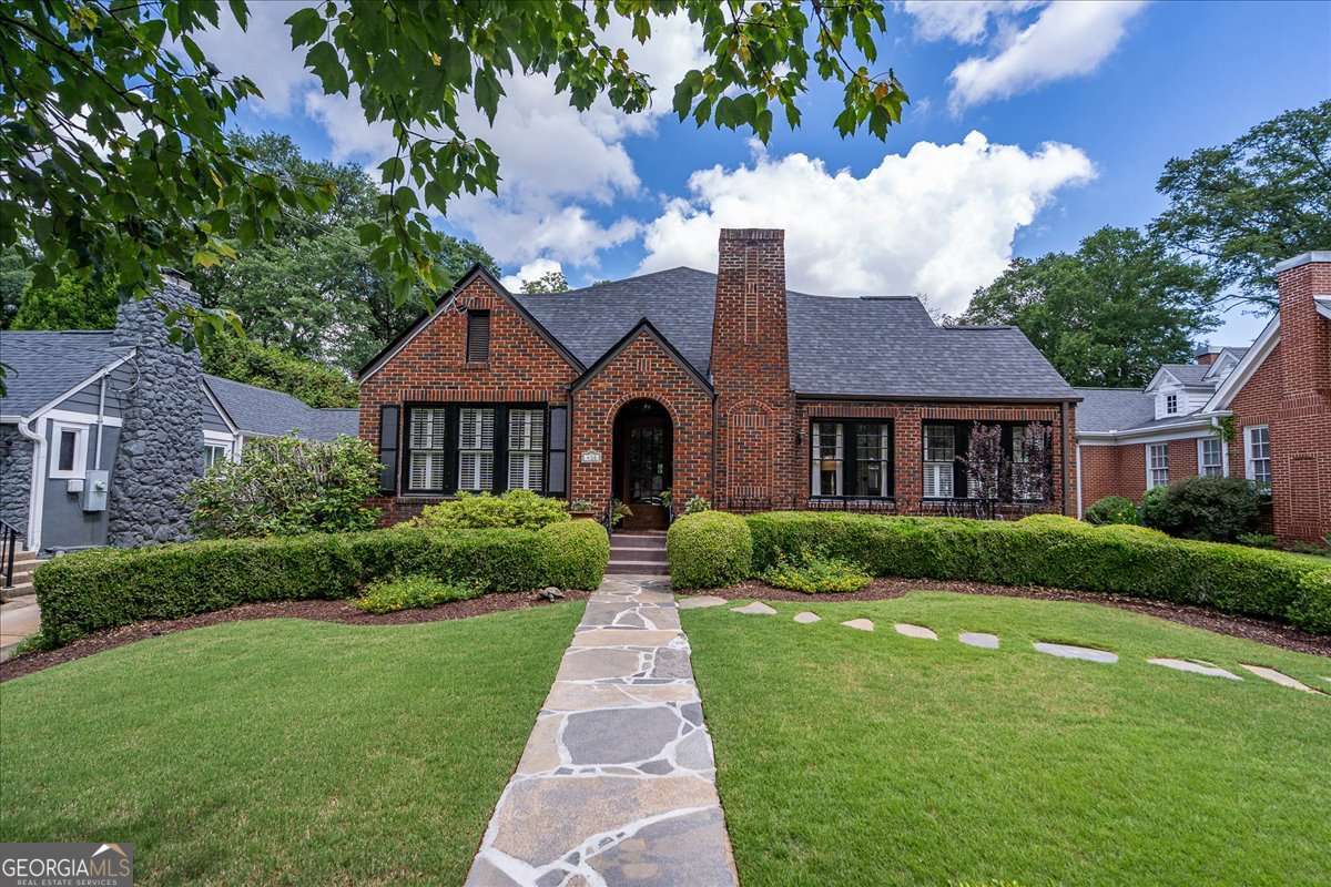 a front view of a house with a yard
