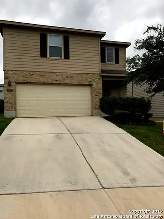 a front view of a house with garage