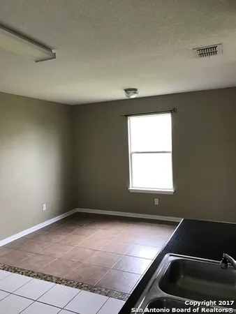 a view of an empty room and window