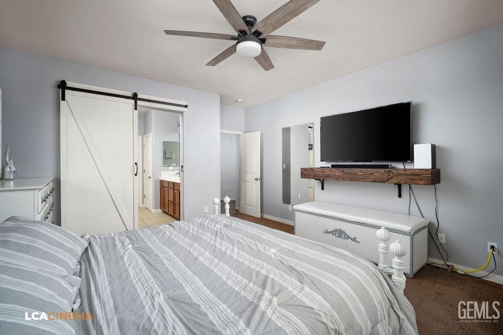 Undisclosed Address Bakersfield, CA 93314 - Photo 15 of 22 a bedroom with a bed and a flat screen tv