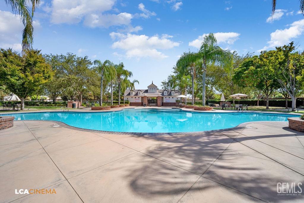 Undisclosed Address Bakersfield, CA 93314 - Photo 21 of 22 a view of a swimming pool with a yard
