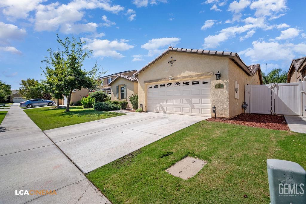 Undisclosed Address Bakersfield, CA 93314 - Photo 4 of 22 a view of a house with a yard