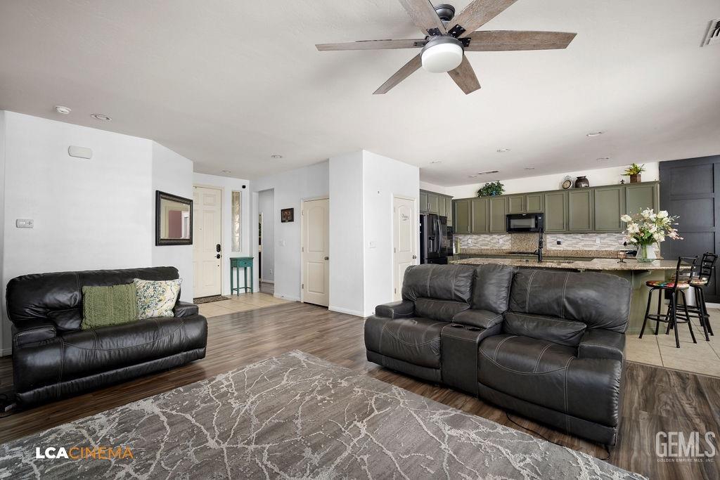 Undisclosed Address Bakersfield, CA 93314 - Photo 5 of 22 a living room with furniture and kitchen view