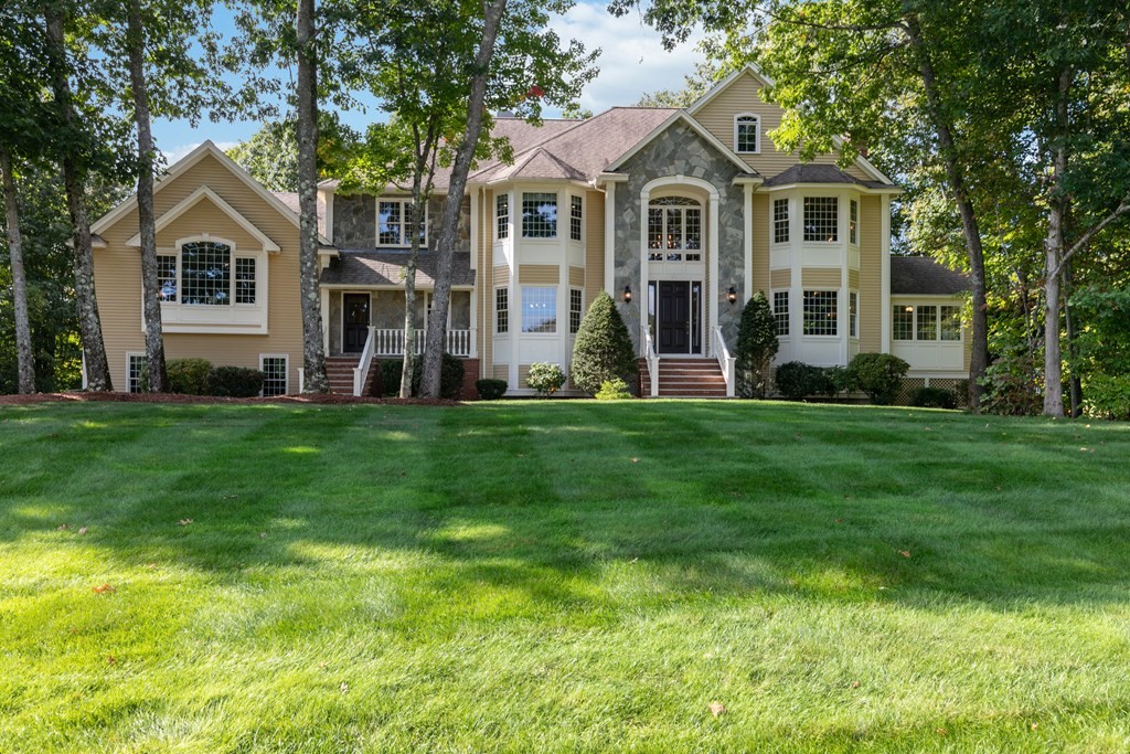 40 Berrington Place North Andover, MA 01845 - Photo 1 of 1 a front view of a house with a garden