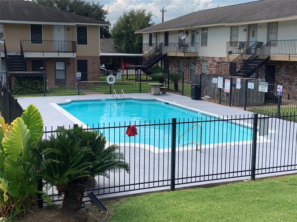 3302 Burke Road, Unit 9 Pasadena, TX 77504 - Photo 19 of 20 a view of a house with backyard and sitting area