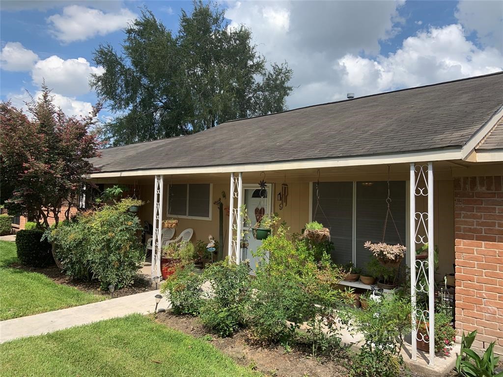 3302 Burke Road, Unit 9 Pasadena, TX 77504 - Photo 2 of 20 a front view of a house with garden