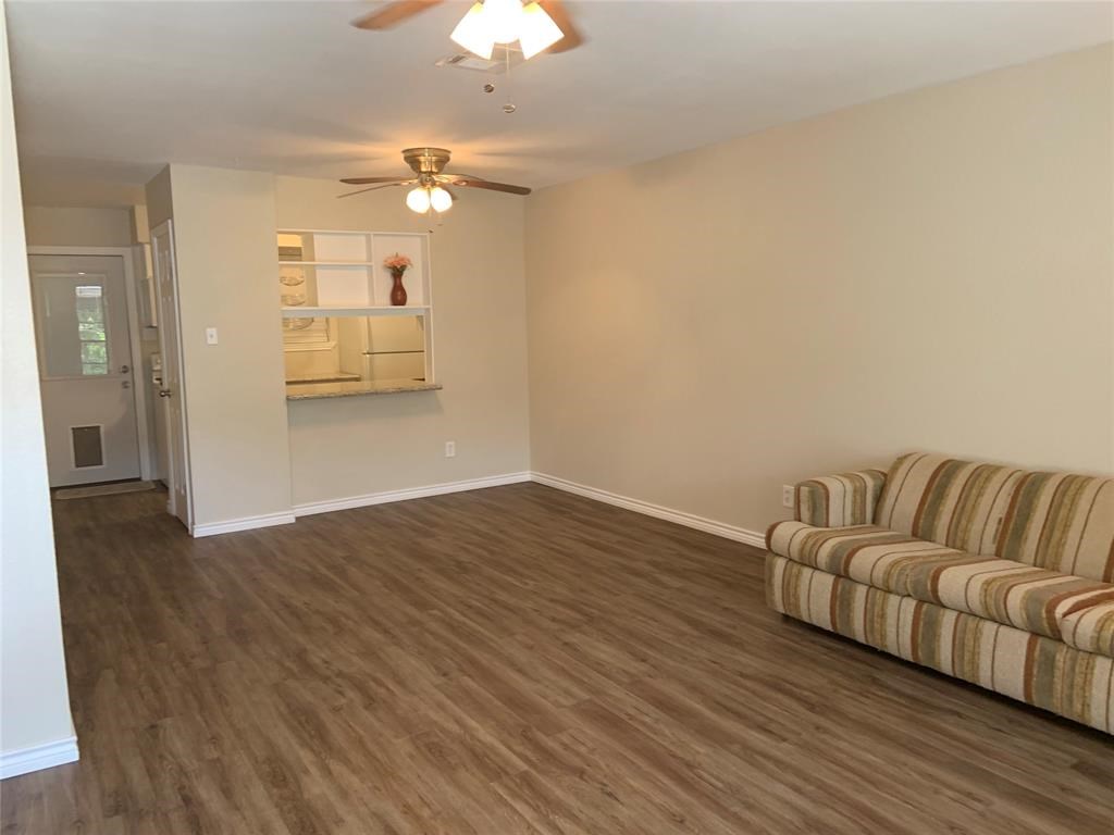 3302 Burke Road, Unit 9 Pasadena, TX 77504 - Photo 6 of 20 a living room with furniture and a chandelier