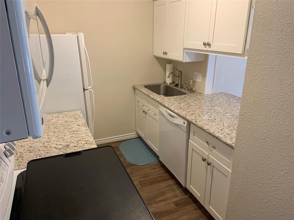 3302 Burke Road, Unit 9 Pasadena, TX 77504 - Photo 9 of 20 a kitchen with sink and cabinets