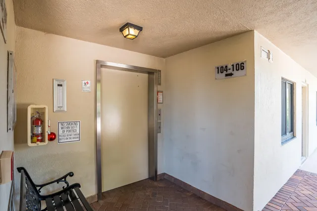 a view of elevator with hallway