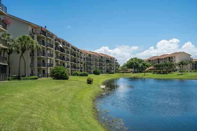 a view of a lake with a house in the background