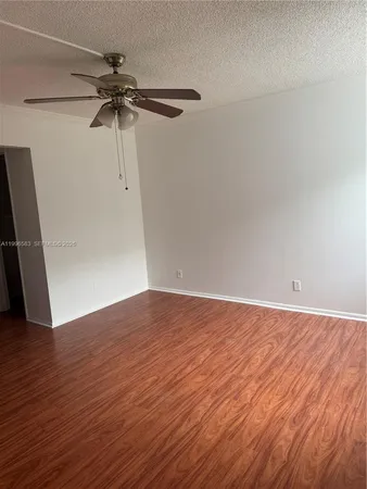 wooden floor in an empty room with a mirror
