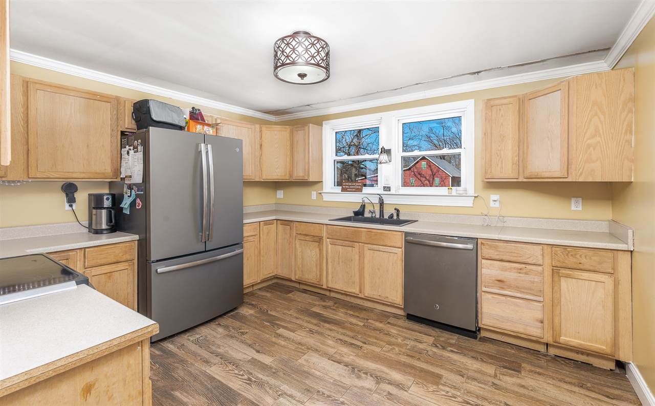 3159 Lyndhurst Road Stuarts Draft, VA 24477 - Photo 8 of 49 a kitchen with a refrigerator and a sink