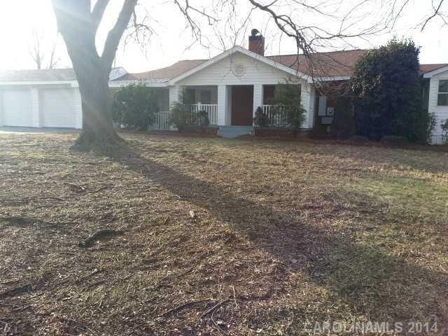4605 Griffith Road Monroe, NC 28112 - Photo 1 of 16 a front view of a house with a yard