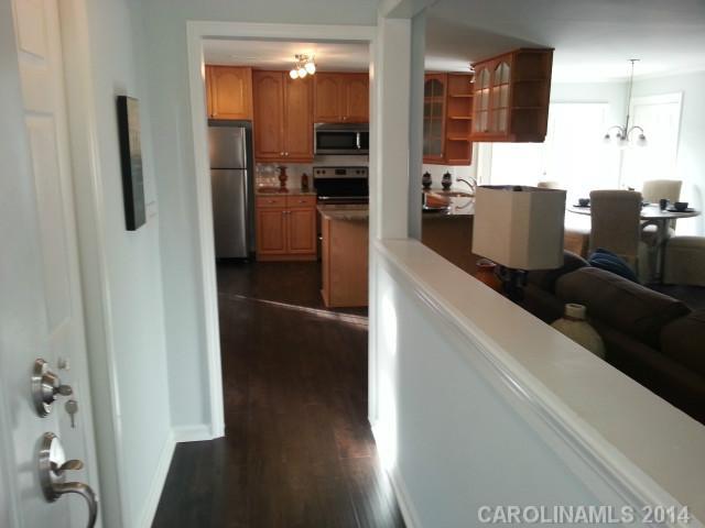4605 Griffith Road Monroe, NC 28112 - Photo 2 of 16 a kitchen with stainless steel appliances kitchen island granite countertop a refrigerator and a sink