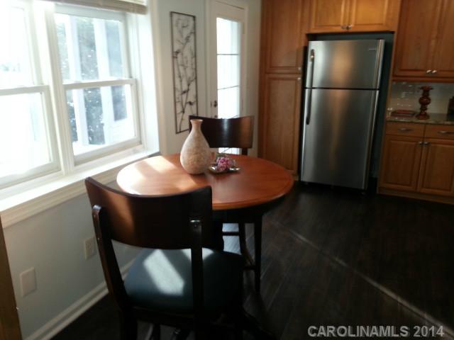 4605 Griffith Road Monroe, NC 28112 - Photo 6 of 16 a kitchen with a refrigerator and a table