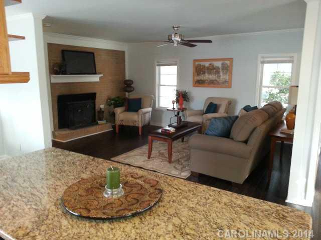 4605 Griffith Road Monroe, NC 28112 - Photo 8 of 16 a living room with furniture and a fireplace