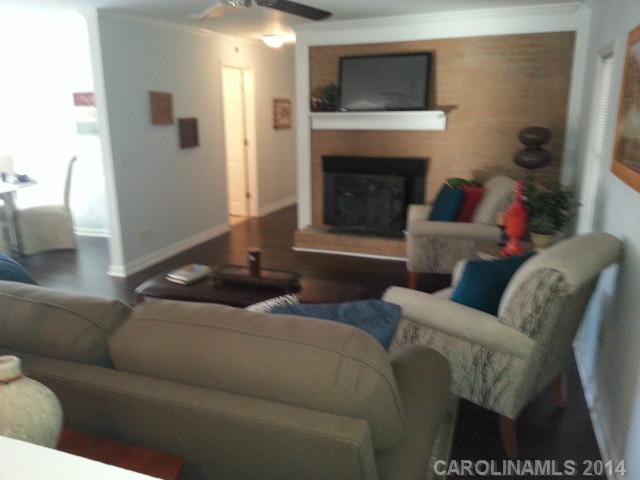 4605 Griffith Road Monroe, NC 28112 - Photo 9 of 16 a living room with furniture and a fireplace