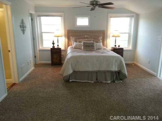 4605 Griffith Road Monroe, NC 28112 - Photo 10 of 16 a spacious bedroom with a bed and a window