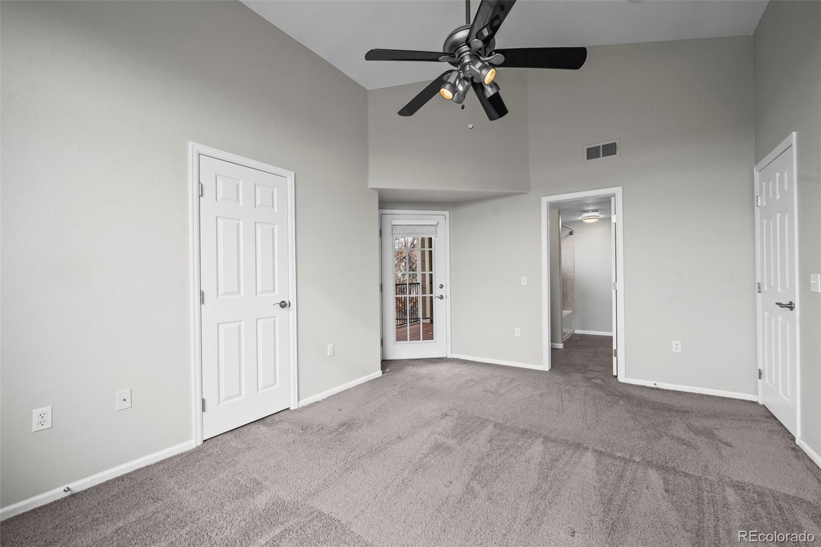 10787 Twenty Mile Road, Unit 301 Parker, CO 80134 - Photo 14 of 31 a view of empty room with ceiling fan