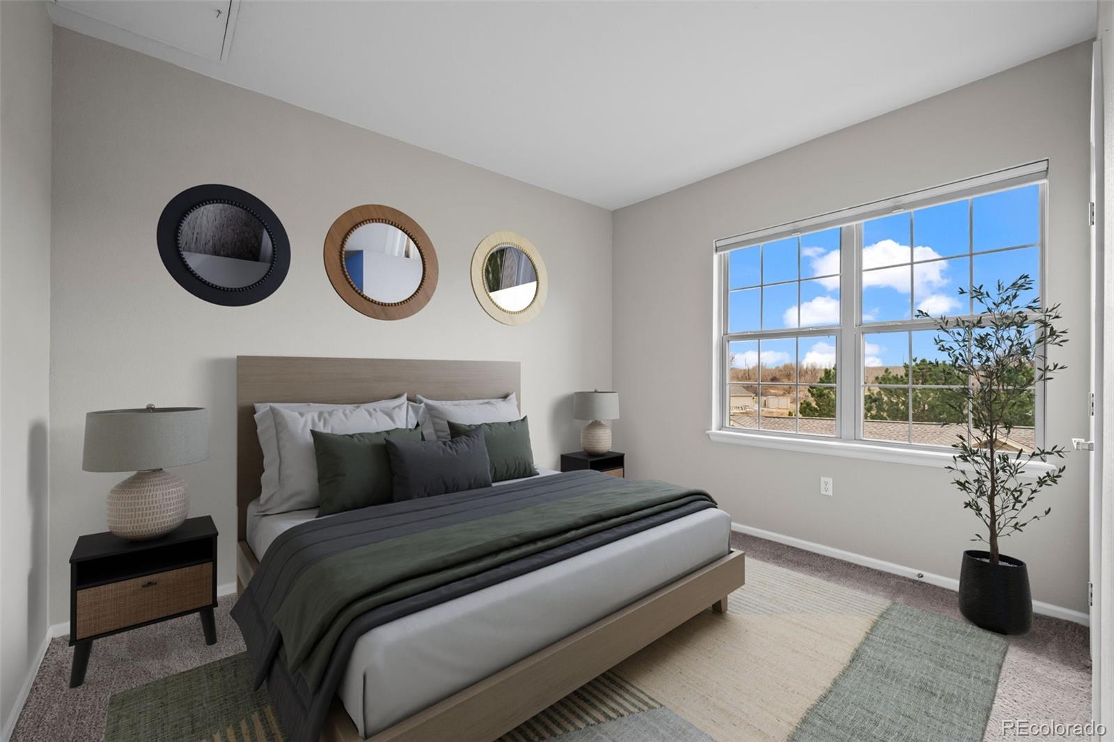 10787 Twenty Mile Road, Unit 301 Parker, CO 80134 - Photo 17 of 31 a bedroom with a bed and window
